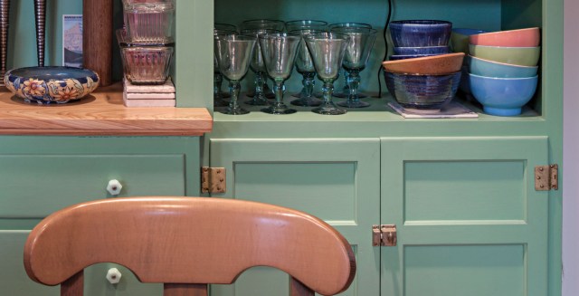 fold-back hinges on green cabinets