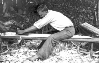 FIG. 131. Board for sowing tray being planed with jack plane. Avinurme, Ulvi village. Photograph by author, 1947. Photo library 1089:106.