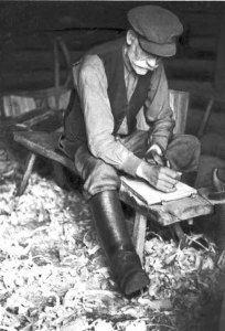 FIG. 57. Planing a base for a wooden container. Avinurme. Maetsma village. Photograph by author, 1949. Photo libarary 1127:13.