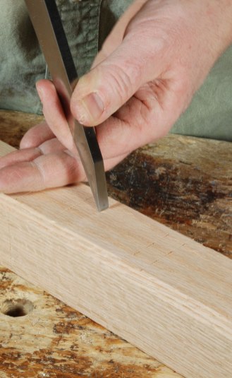 Fig. 4.5. Now move the chisel over one chisel-width. And lean on it. Now your setting is marked on the timber, and you just need to set the mortise gauge according to the chisel marks.