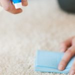 man cleaning carpet